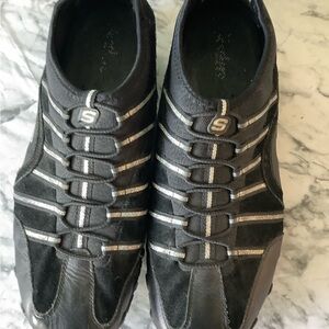 Women’s size 11M Skechers pull on  black & silver metallic rubber sole shoes